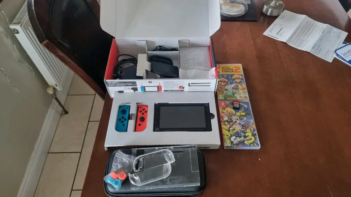Nintendo Switch with accessories - Image 1