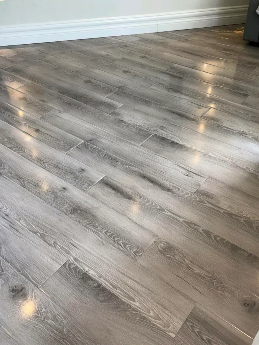 Brand new grey 12mm high gloss flooring