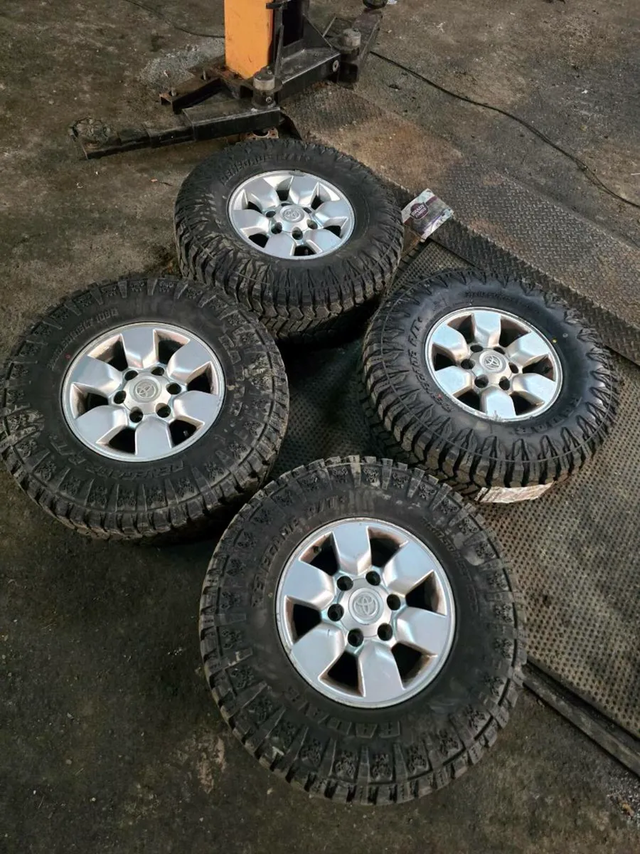 6x139.7 15 inch hilux alloys with mud tyres - Image 1