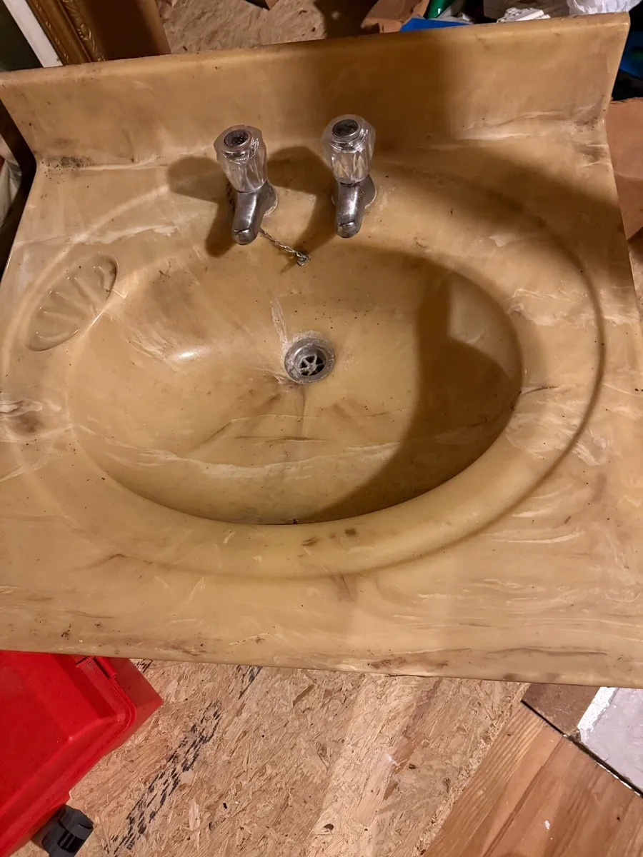 Cream marble effect sink with taps - Image 1