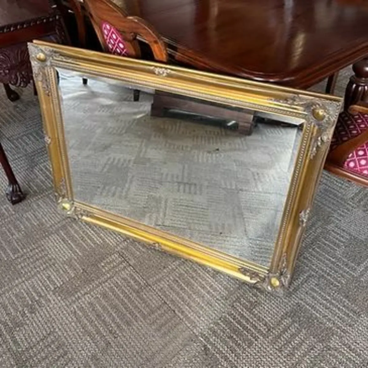 Ornate gilt framed wall mirror