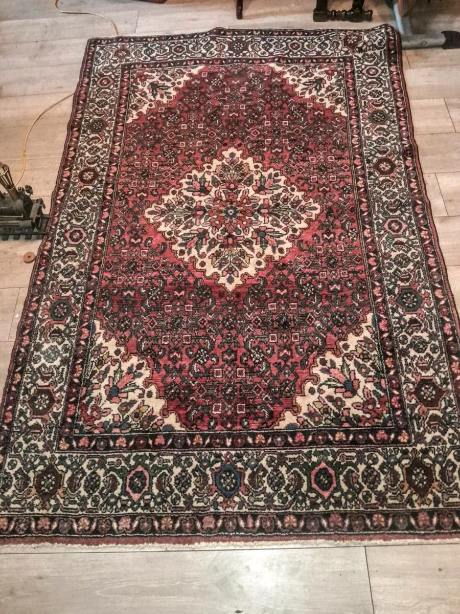 Large hand knotted antique Oriental rug with label - Image 1