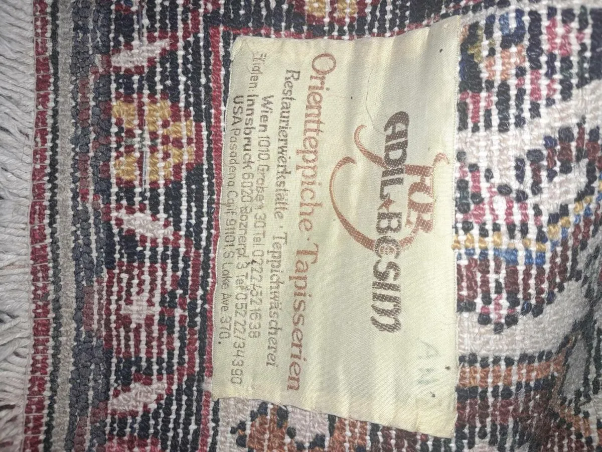 Large hand knotted antique Oriental rug with label - Image 4