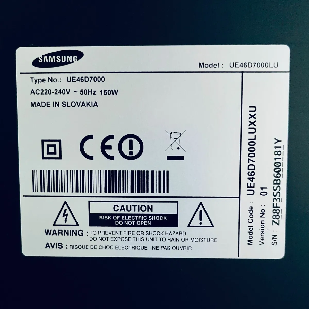 Samsung TV and black glass TV stand - Image 2