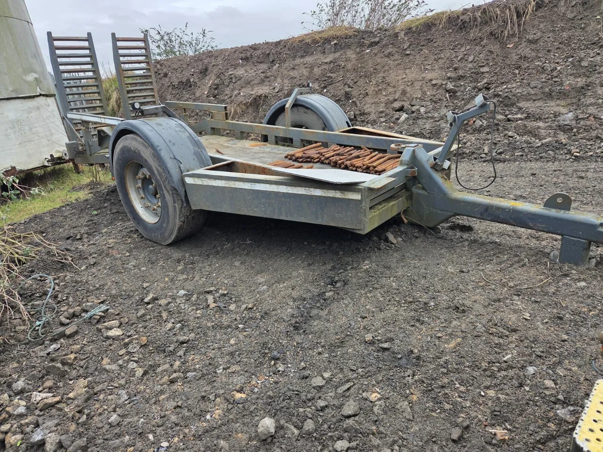 Tractor drawing lowloader trailer - Image 1