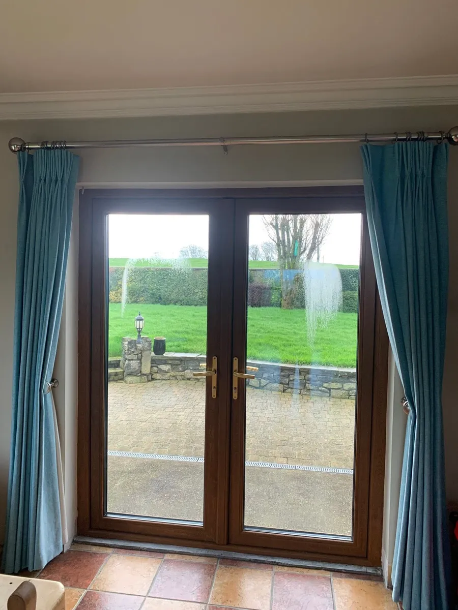 Teal lined curtains, pole & chrome tie backs