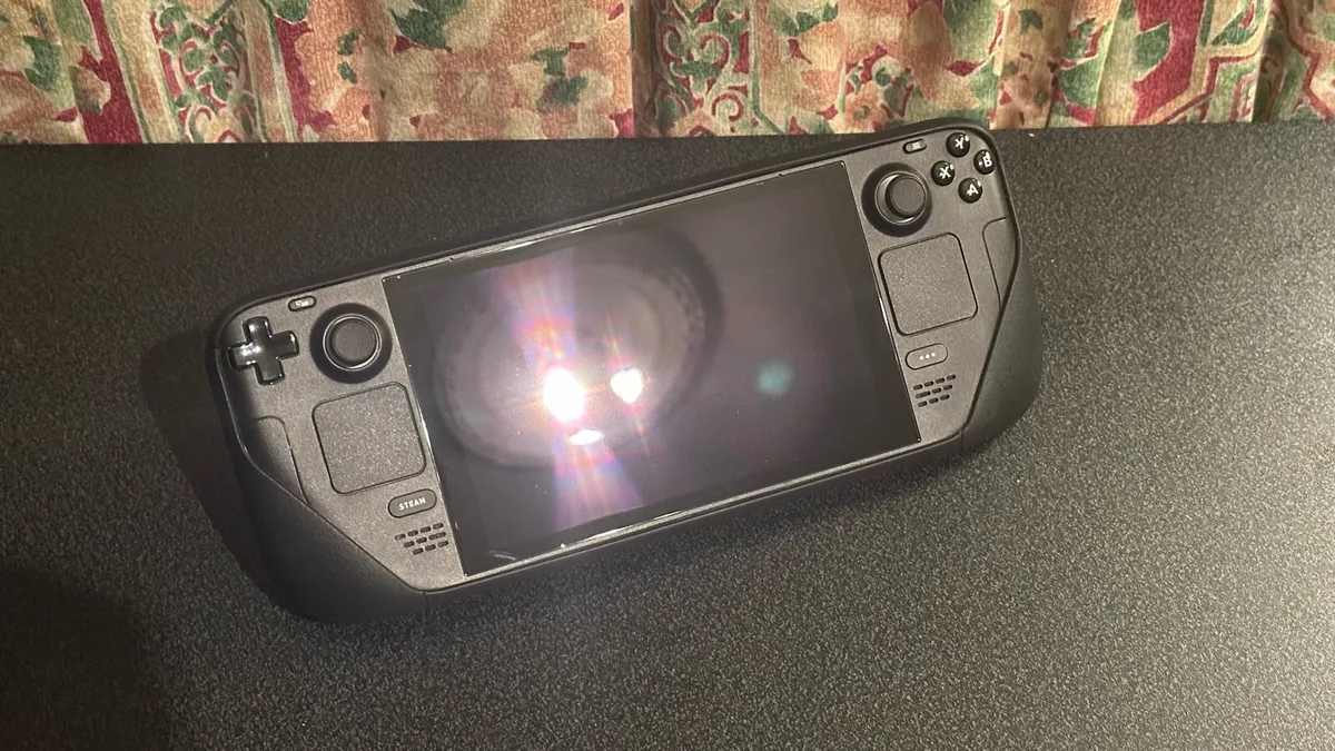 Steam Deck LCD 256GB, cases, protector, charger - Image 1