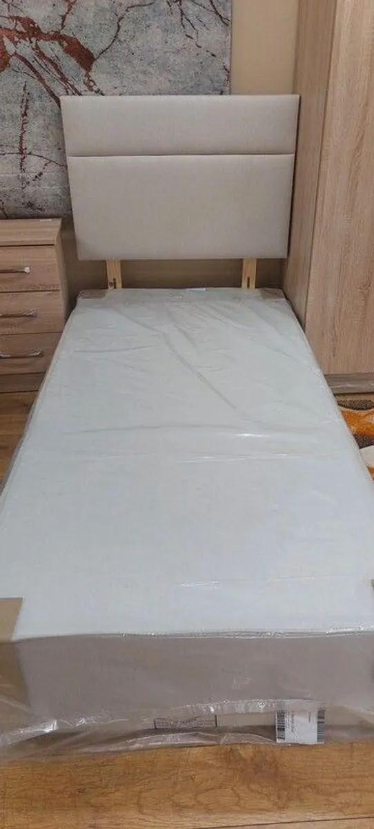 Cream divan single bed base and headboard