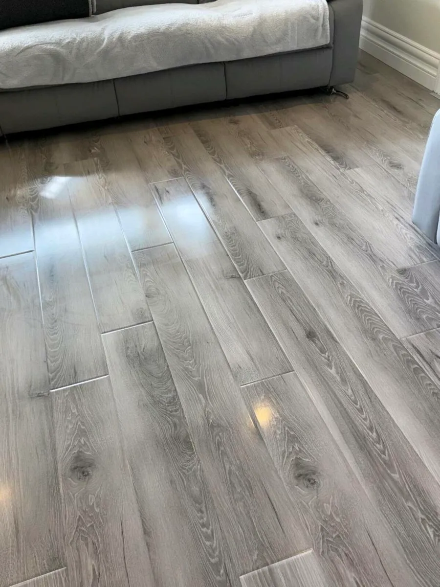 Brand new 12mm high gloss flooring - Image 1