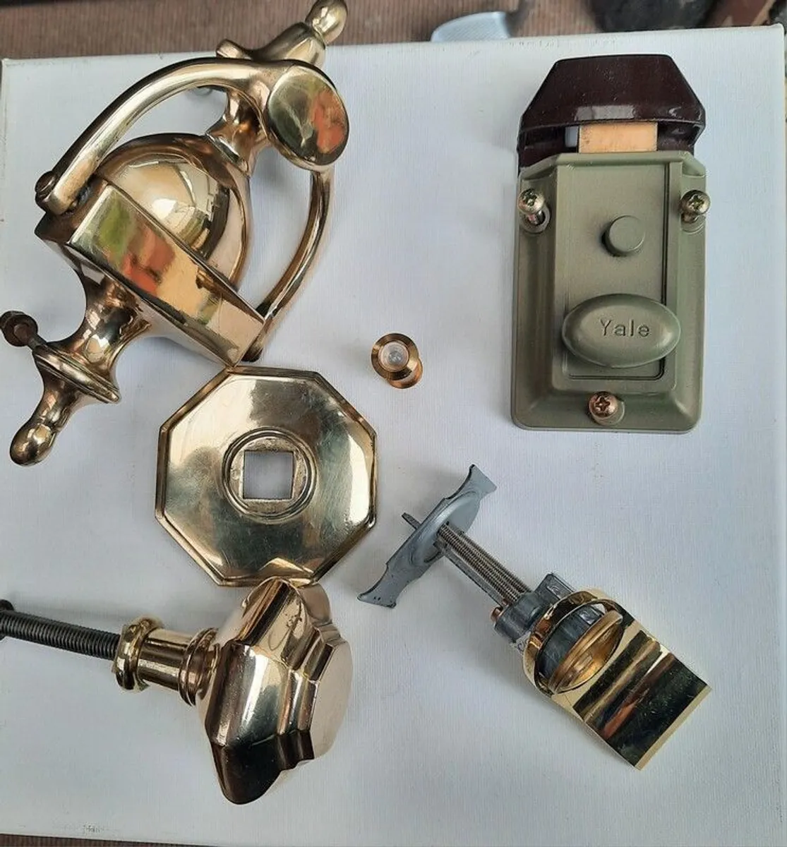 Solid brass front door fixtures in perfect condition .Brass knob. Brass handle.brass key handle.Spyhole.Complete yale door lock with keys as new