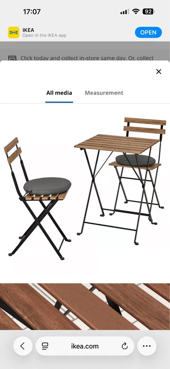 IKEA wooden table with 4 matching foldable chairs - Image 1