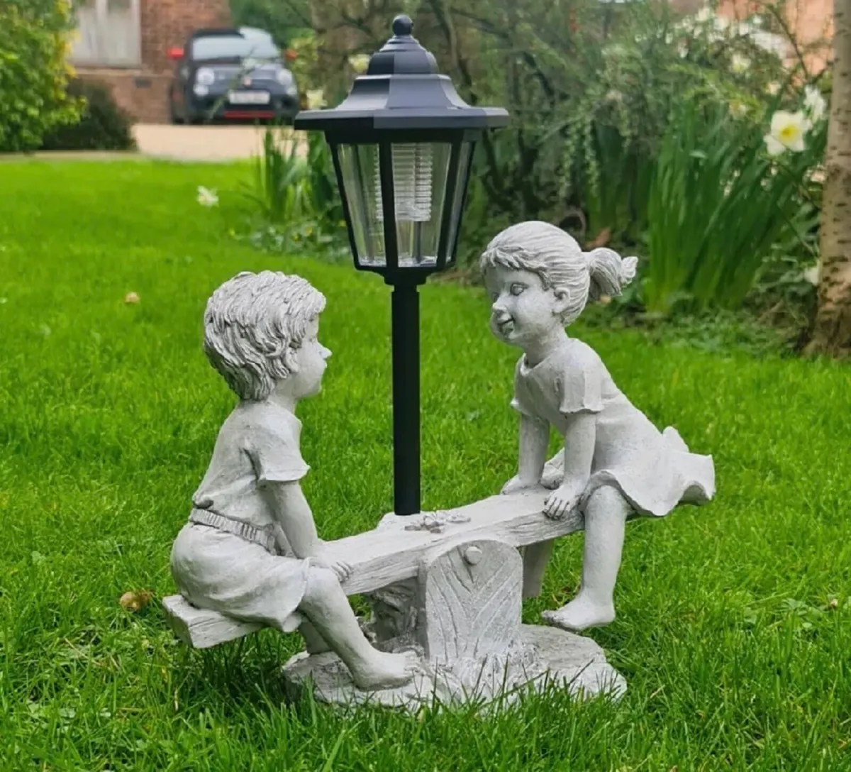 Solar Light Boy & Girl Seesaw Stone Effect Garden - Image 1