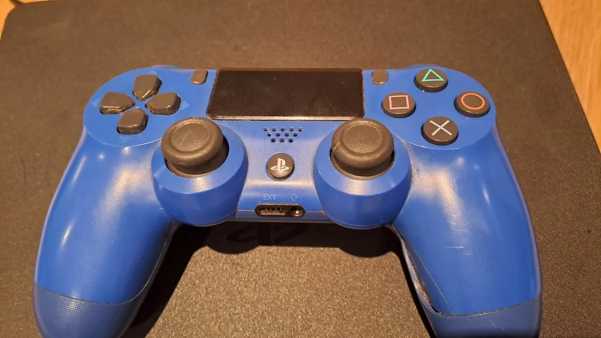 Playstion 4 with one controller and four games - Image 2