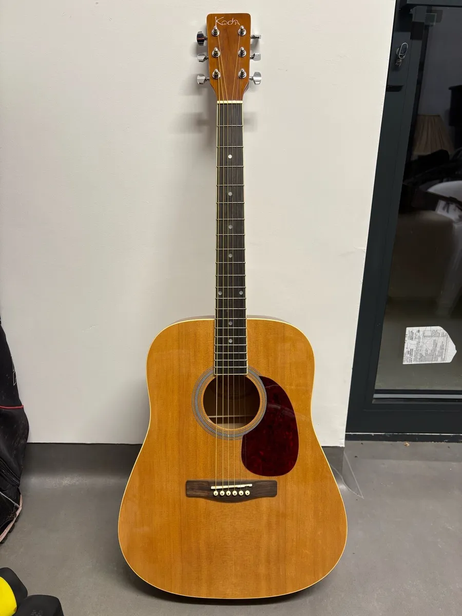 Koda acoustic guitar with capo - Image 1