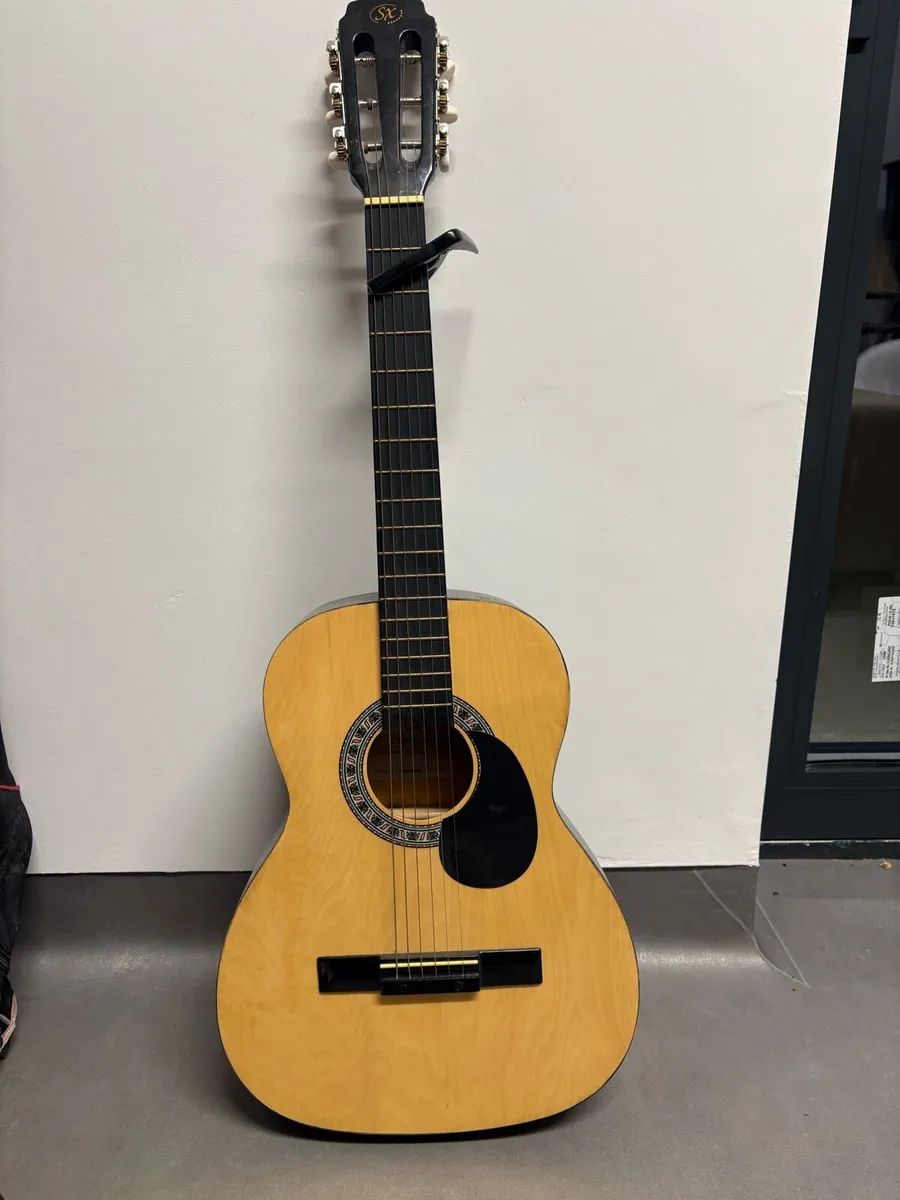 SX acoustic kids guitar with capo - Image 1