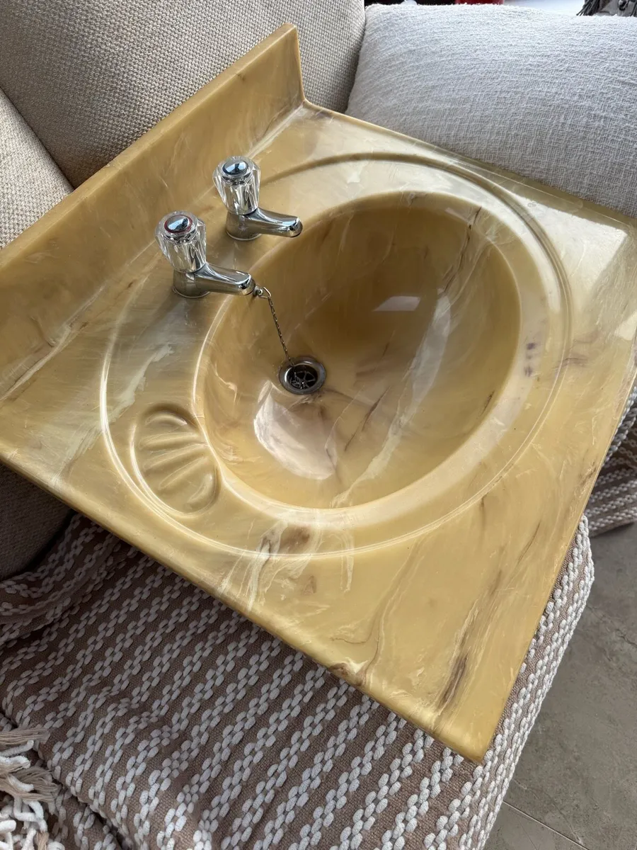 Beige swirled marble pattern sink with taps - Image 2
