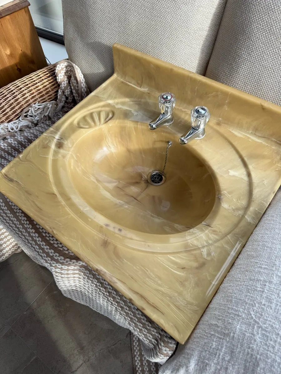 Beige swirled marble pattern sink with taps - Image 3