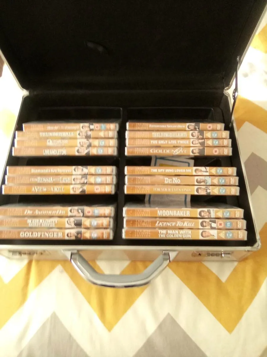 20.  JAMES. BOND.  D.V.D.S.  IN.  DISPLAY.  CASE - Image 1
