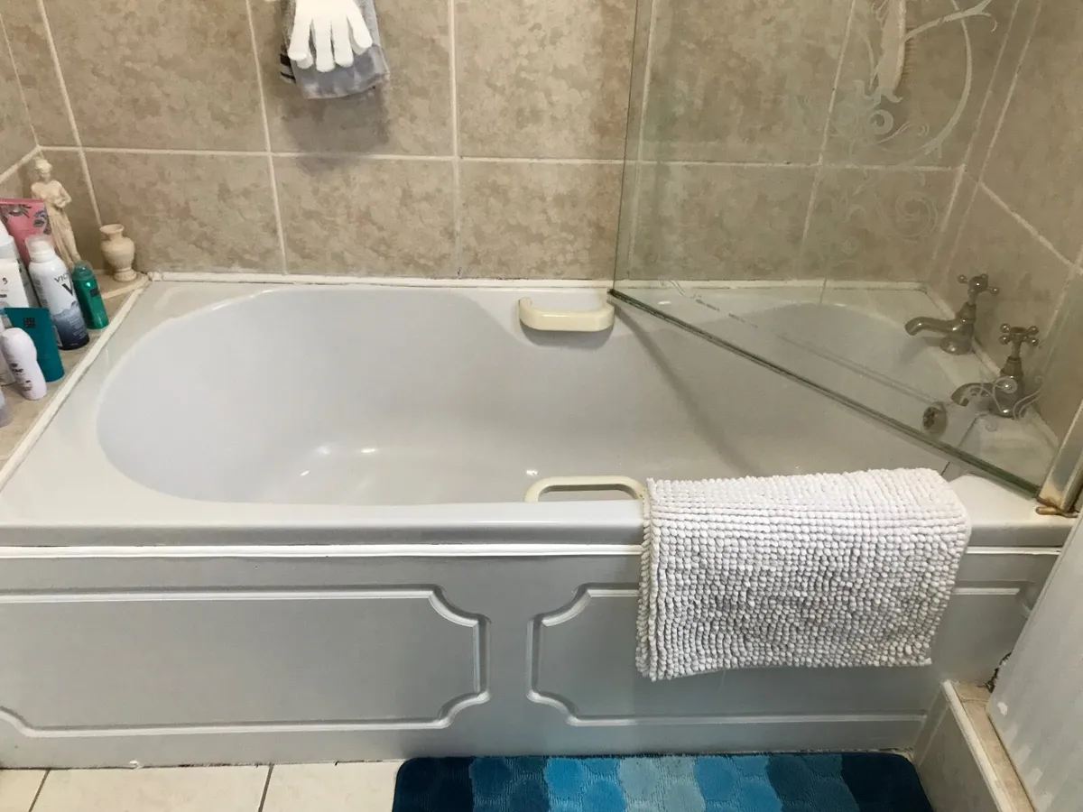 Bathroom sink and toilet and bath - Image 2