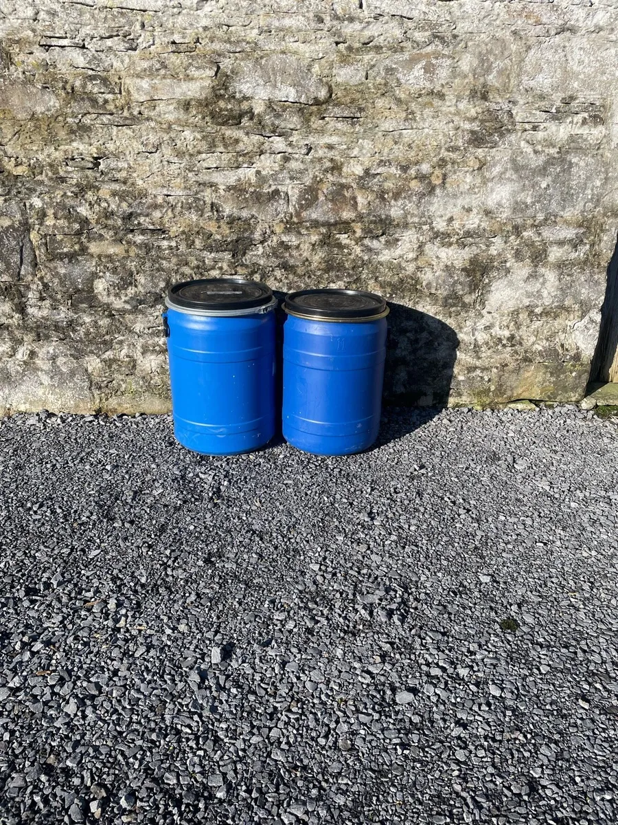 Blue plastic barrels with clip on lids. - Image 1