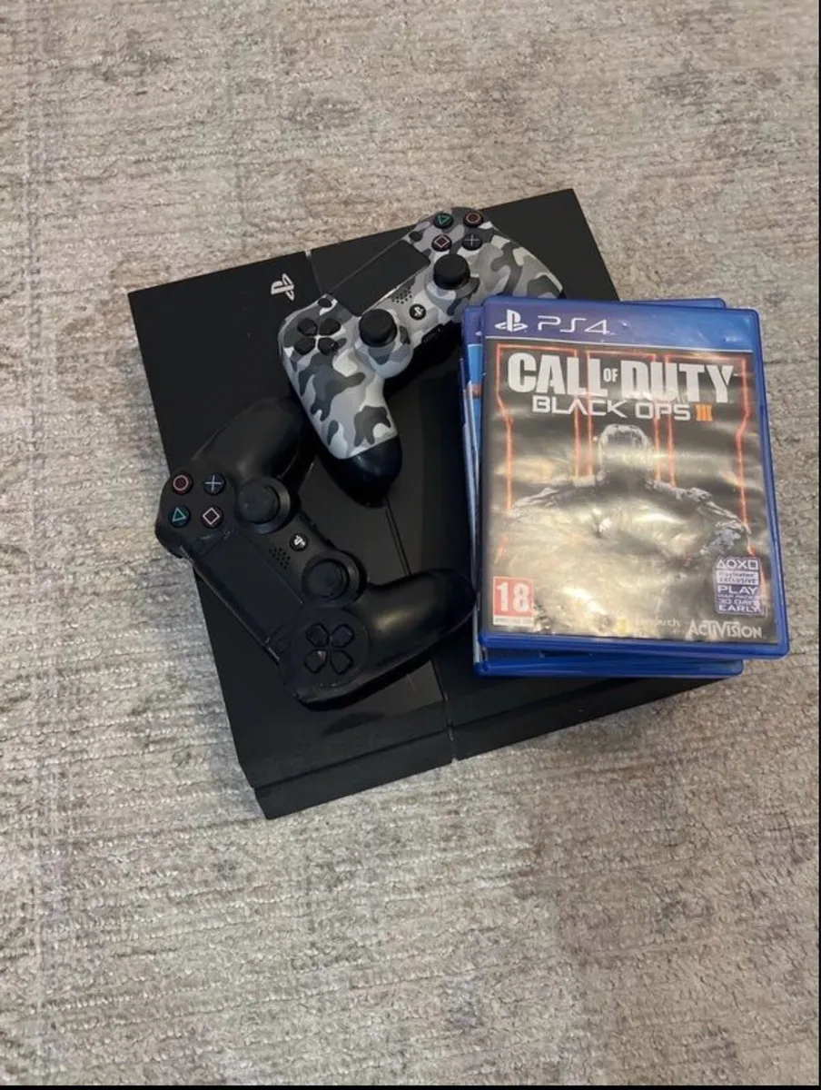 PS4 Console with controllers and CDs