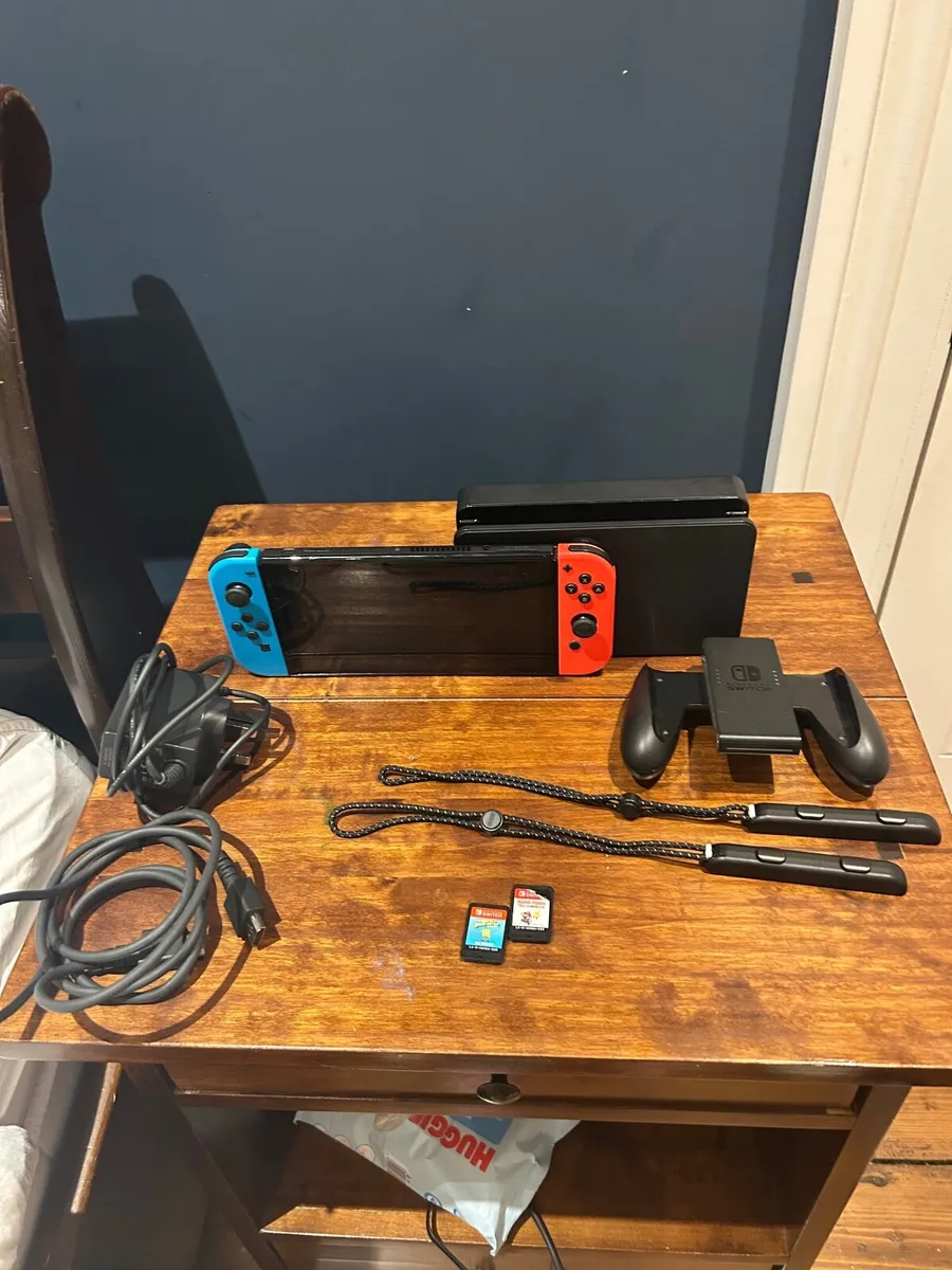 Nintendo Switch OLED with two games - Image 1