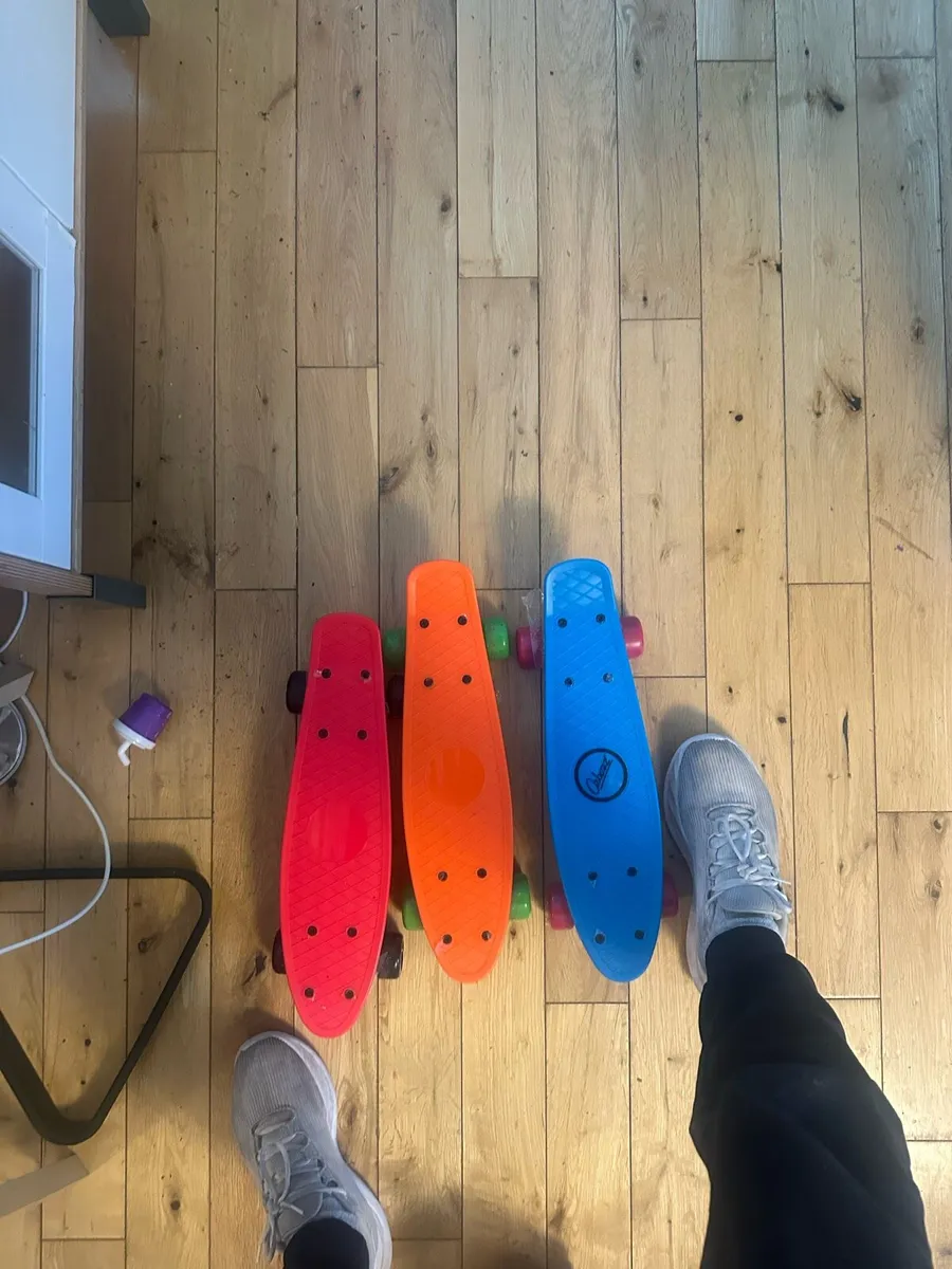 3 small skateboards