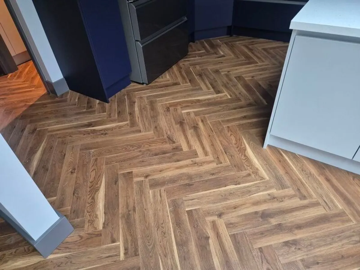 12mm herringbone laminate flooring - Image 1