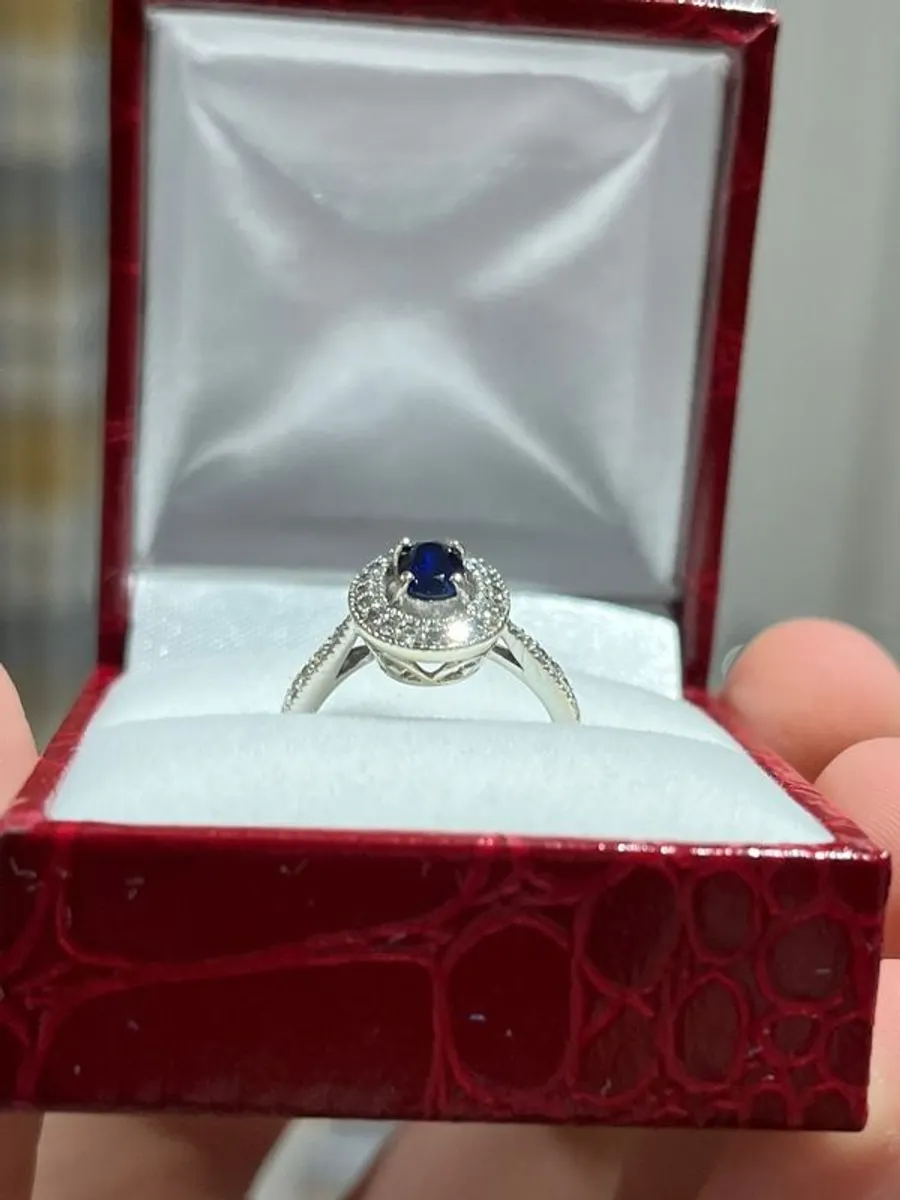 9ct White Gold Diamond Halo and Oval Sapphire Ring - Image 1