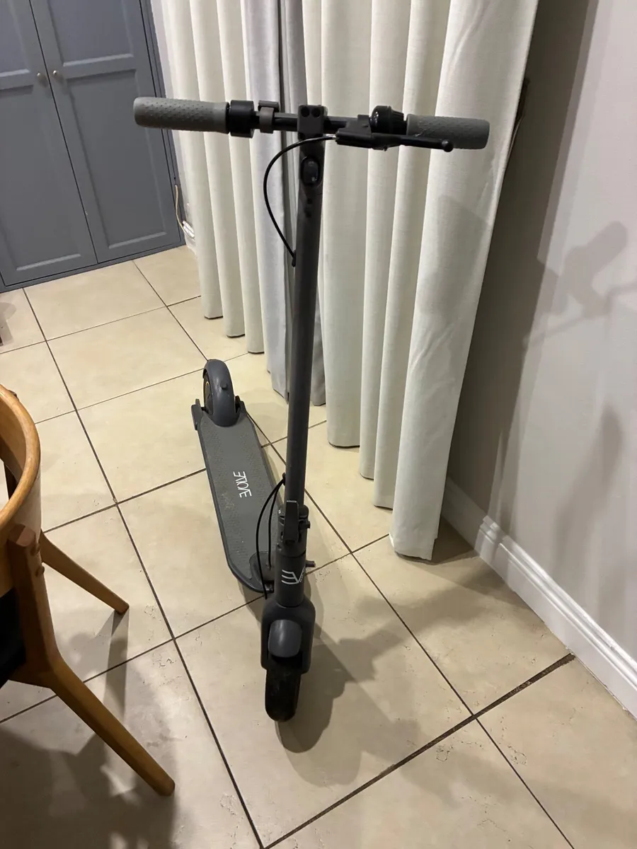 Evolve Electric Scooter & Helmet - Image 1