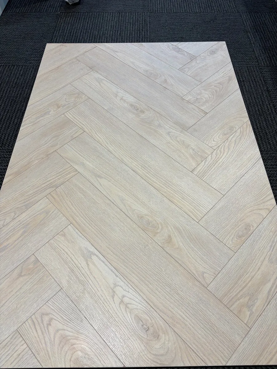 Herringbone Swiss Laminate Floor - Image 1