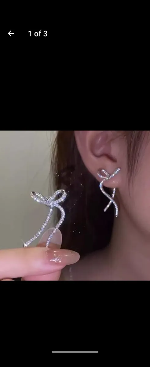 Ribbon Bow Silver Color Drop Earrings material met - Image 1