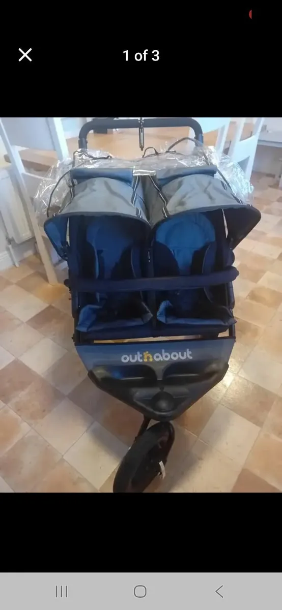 Out and about Nipper double buggy with a rain cove - Image 1