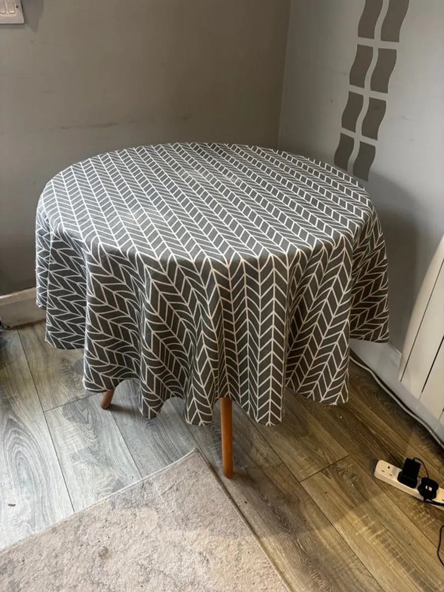 Circular Table with Tablecloth - Image 1
