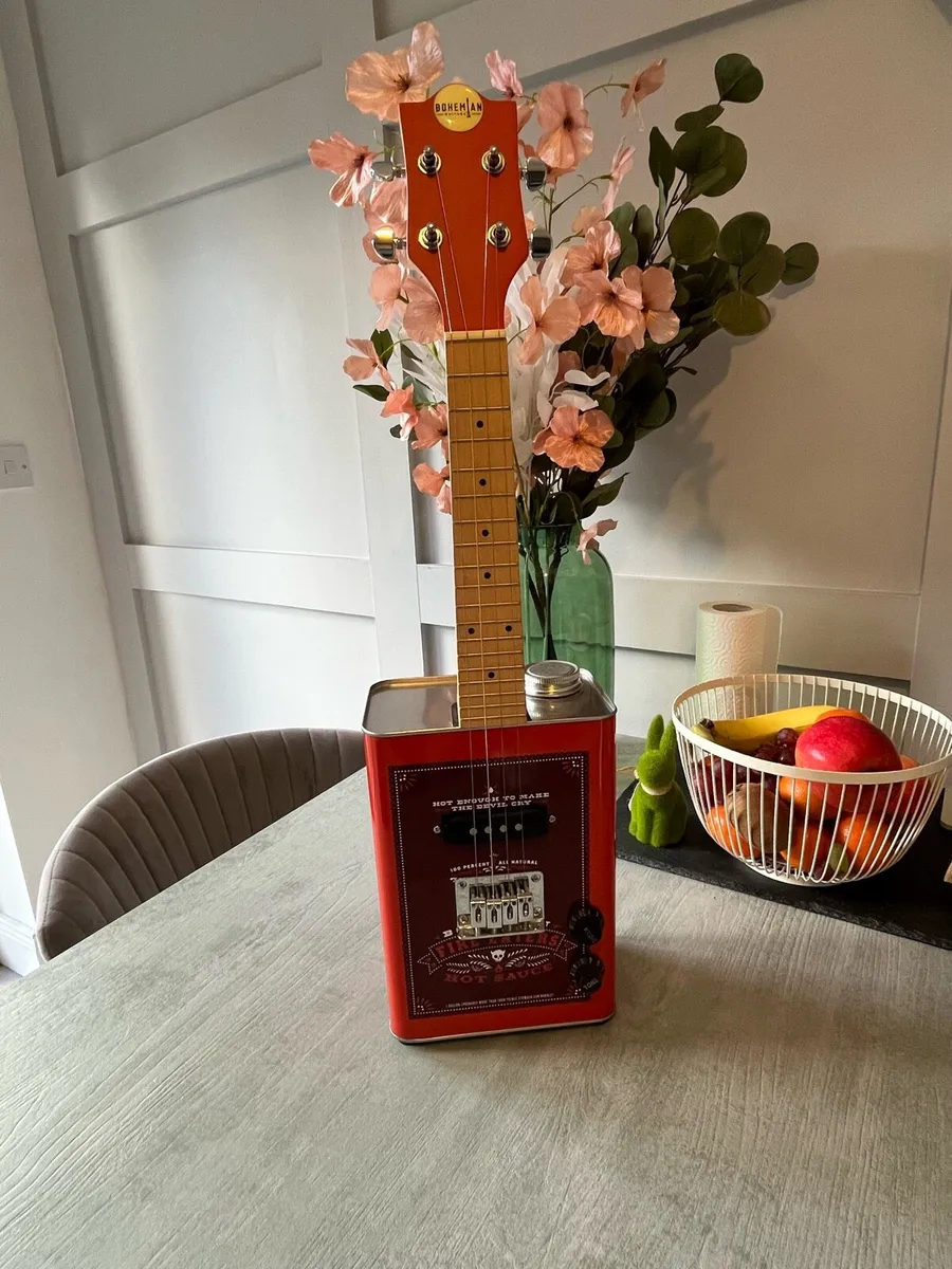 E-Ukulele made out of a hot sauce can - Image 1