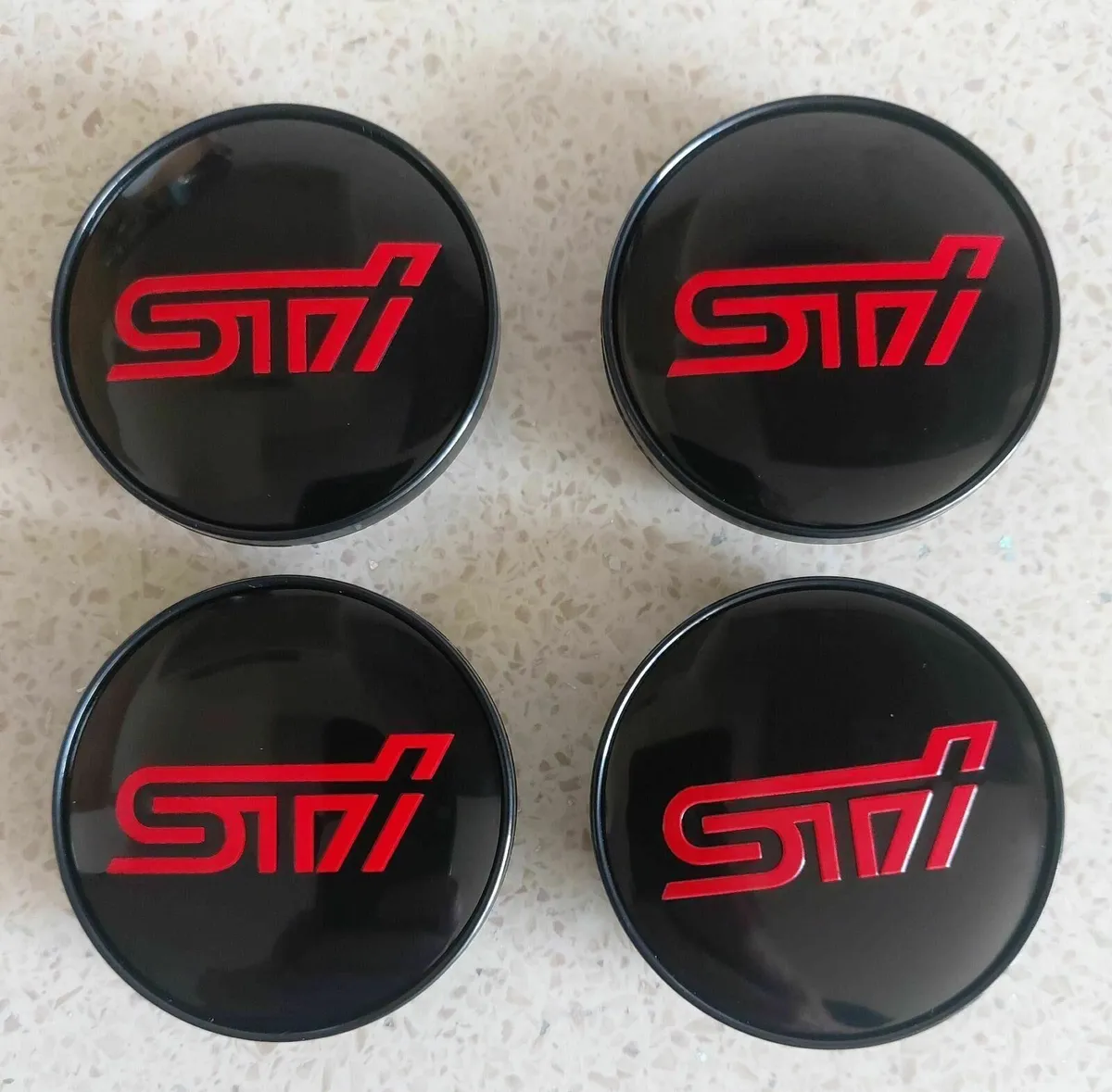 Subaru STI Centre Caps (59mm) FREE POST - Image 1