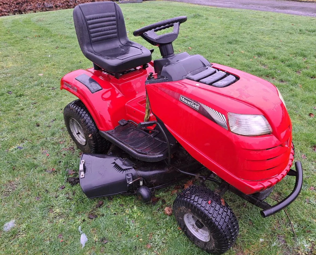 Side discharge ride on petrol lawnmower - Image 1