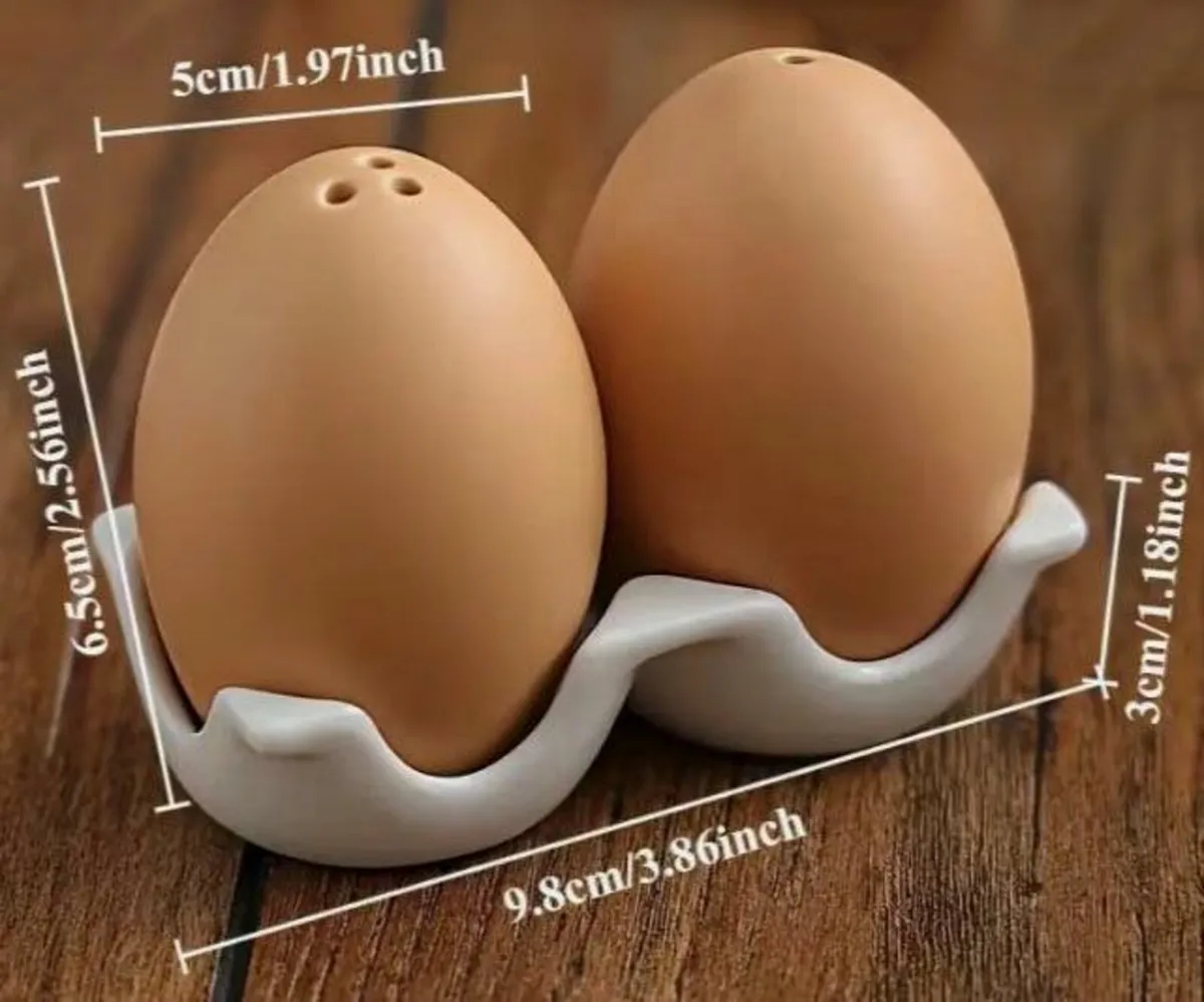 TWO LOOKALIKE EGGS, SALT & PEPPER SHAKERS ( NEW). - Image 1