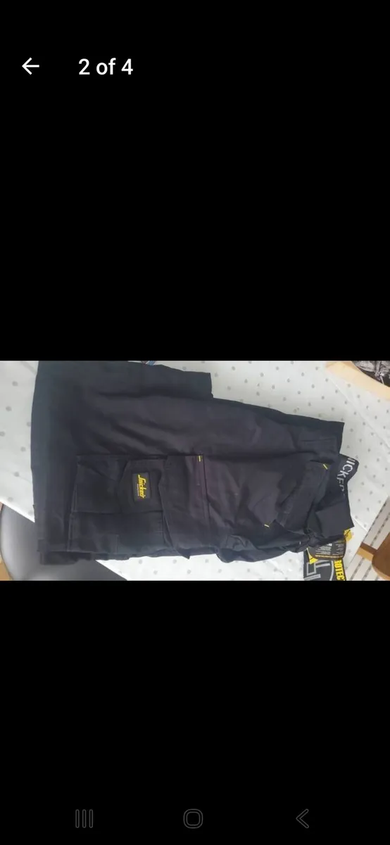 Snickers work trousers x 2 - Image 1