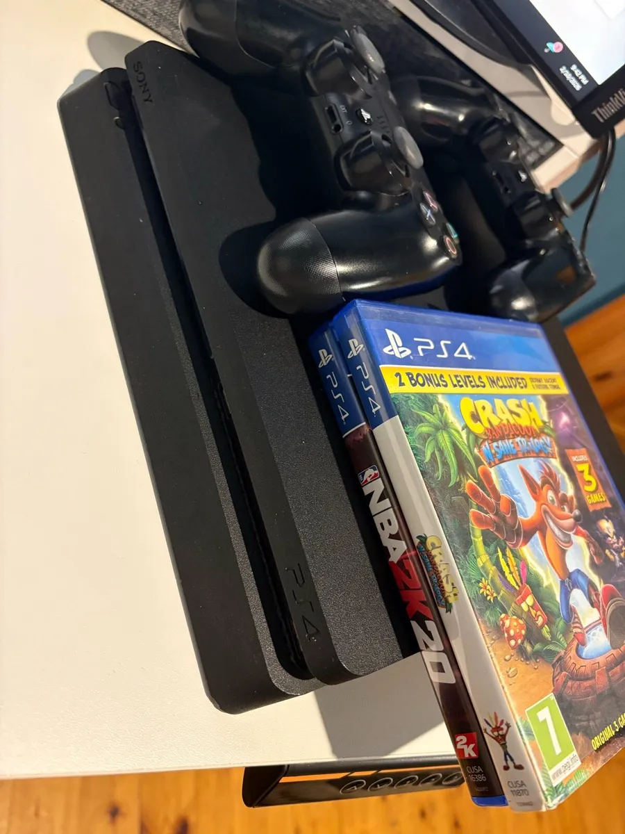 PS4 Slim, Cables, 2 Controllers & 2 Games - Image 1