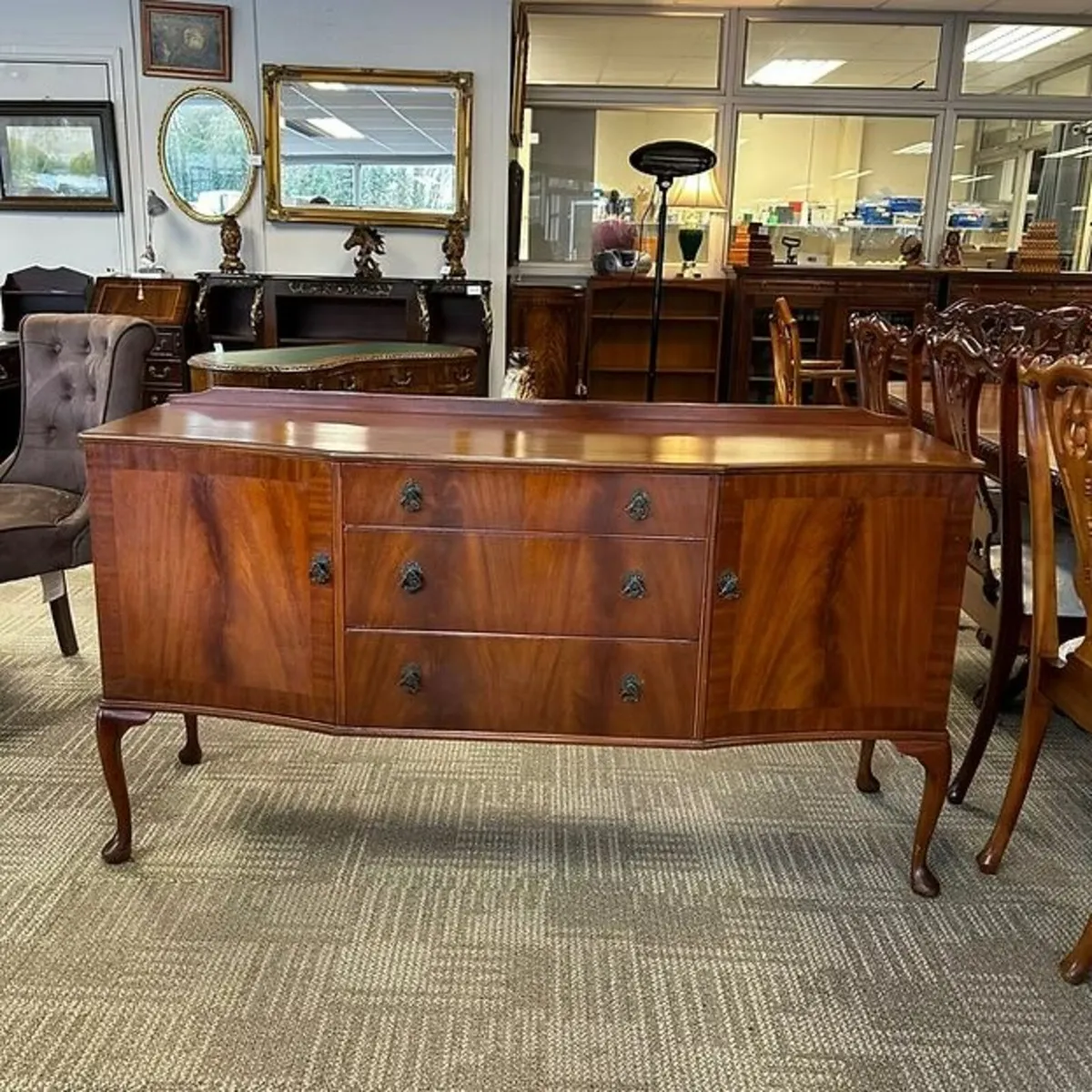Beautiful mahogany breakfront sideboard. Raised on