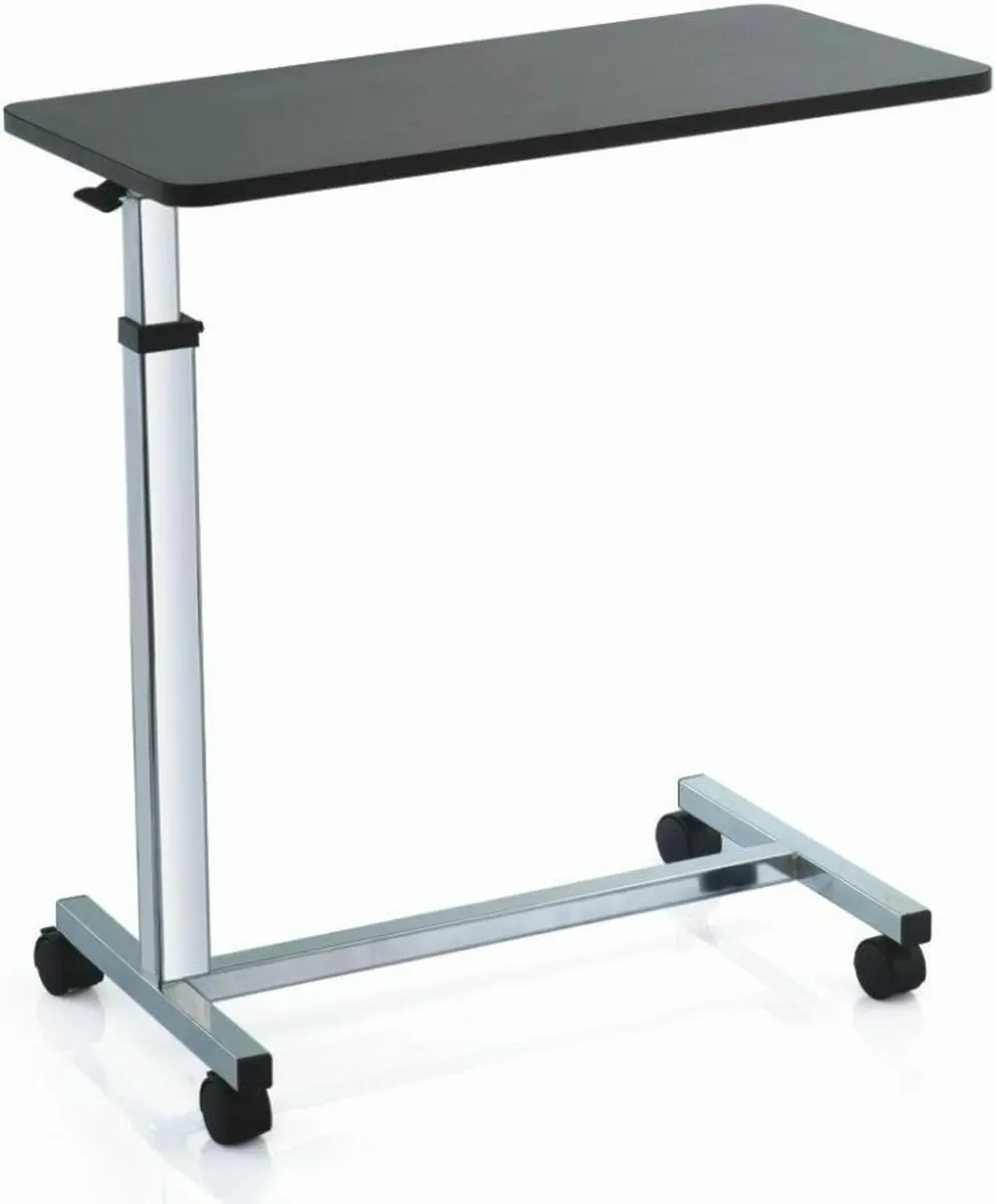 Over bed table with 4 castors and height adjustabl - Image 1