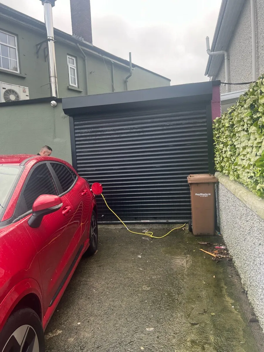 Motorized roller garage shutter - Image 1