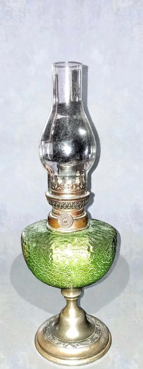 Antique green glass oil lamp