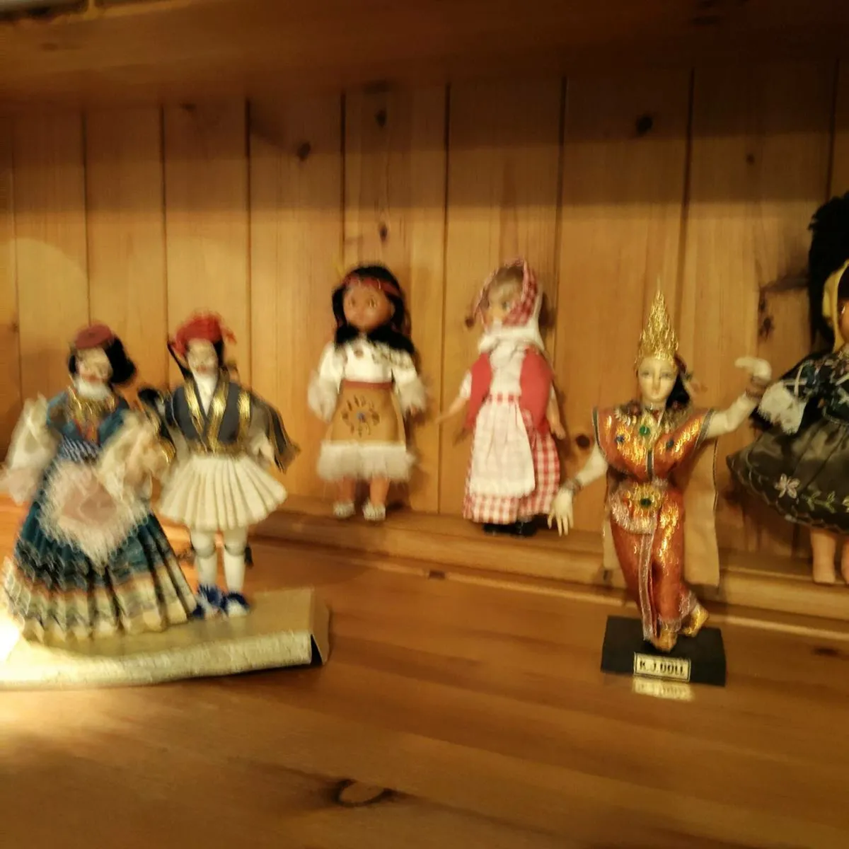 12 Vintage Costume Dolls - Image 1