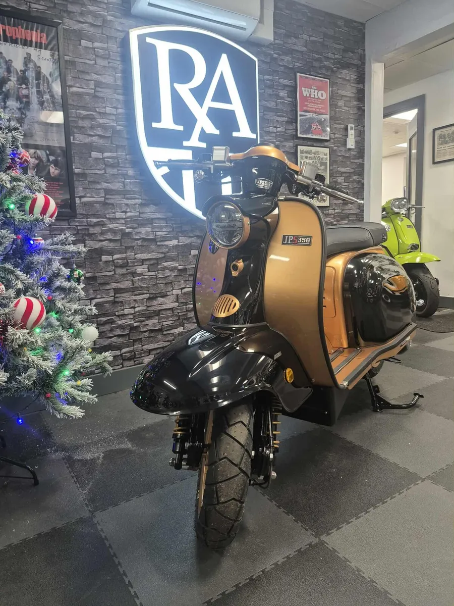 Vespa 50 and RA scooters at scooter island - Image 2