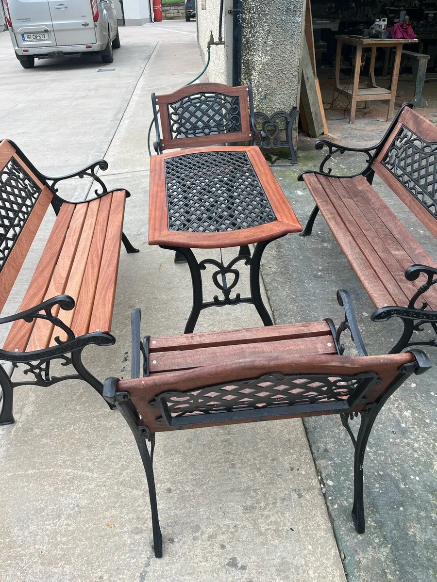 Raised beds bird feeders and cast iron benches - Image 1