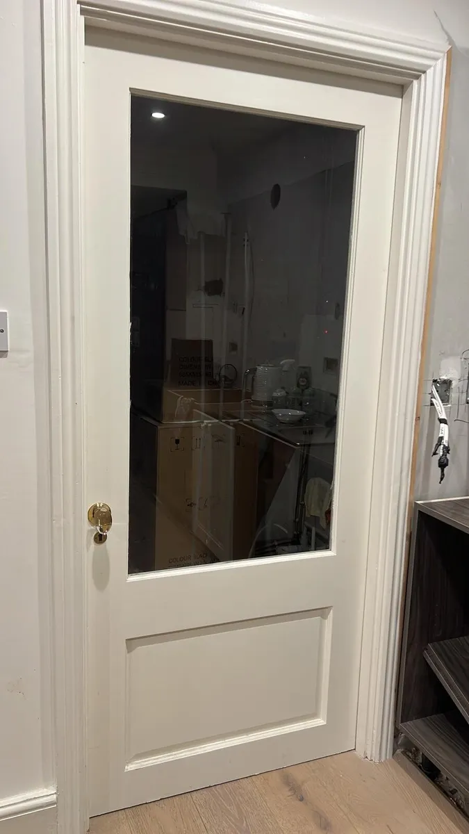 Internal door with glass panel