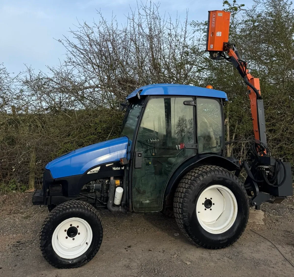 New Holland TCE50 4Wd Compact Tractor. Hedgecutter - Image 1