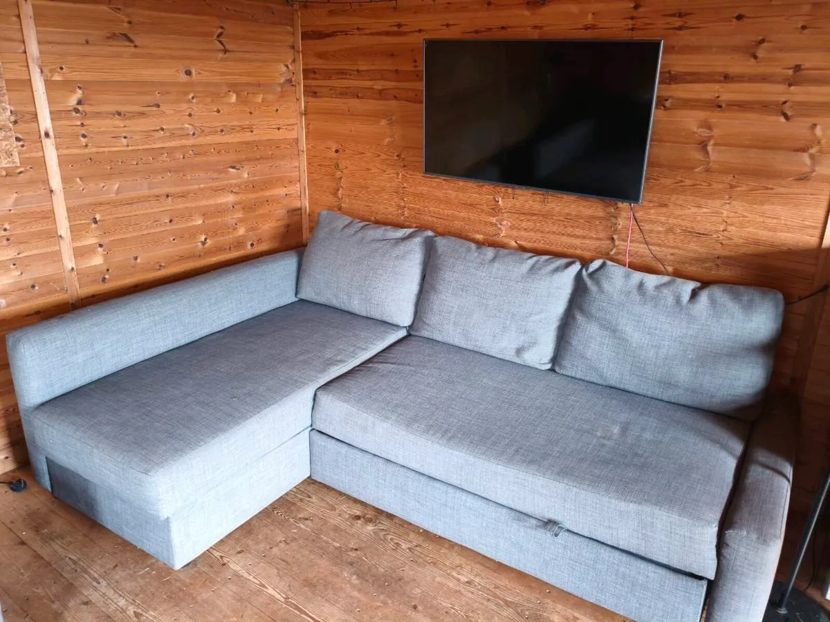 Three seater sofa ved